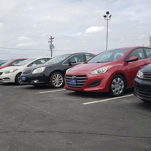 Used cars parked in a lot out in Iowa.